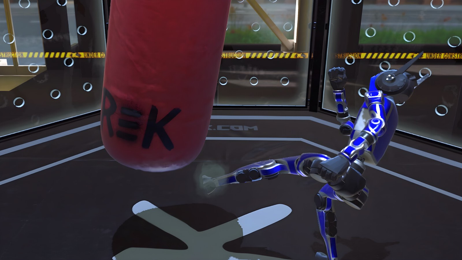 A robot kicking a heavy bag in the REK simulator practice arena